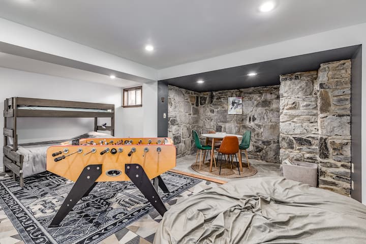 Game Room Retreat: Bunk beds, foosball fun, and a lovely stone wall for a unique hangout spot!