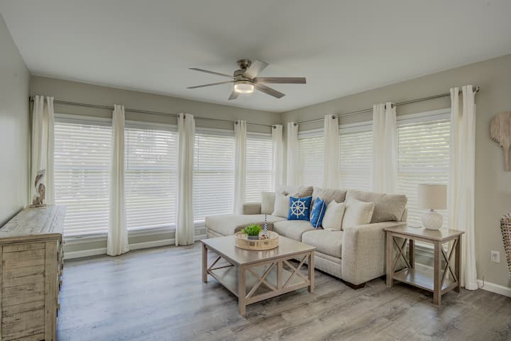 Sun Room with Sofa, TV, and Dining Table