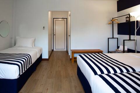 Unique coastal feel room with 3 single beds
