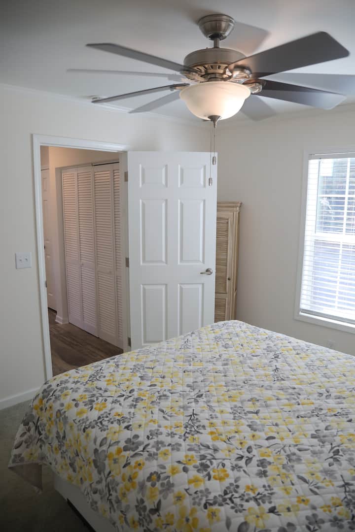The cozy bedroom includes a comfortable queen bed for a restful night's sleep.






