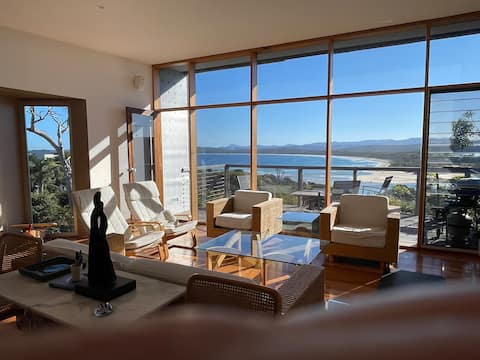 Sun-drenched architect designed overlooking beach