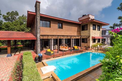 StayVista at Woodstone Villa w/ Pool, Lawn
