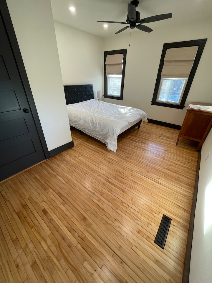 Downstairs bedroom with queen bed