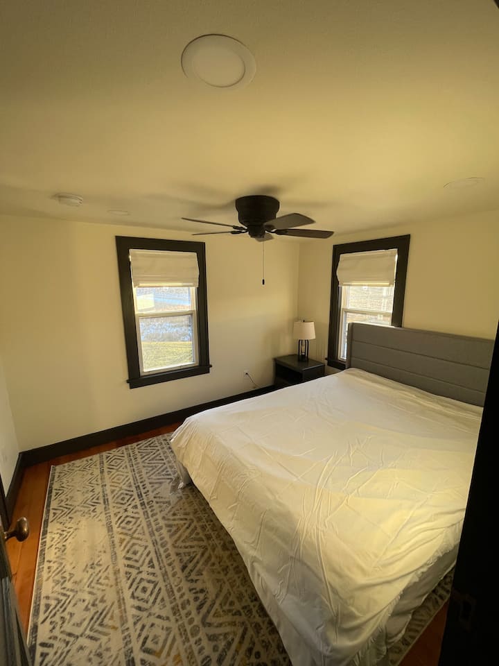 Upstairs bedroom with queen bed.
