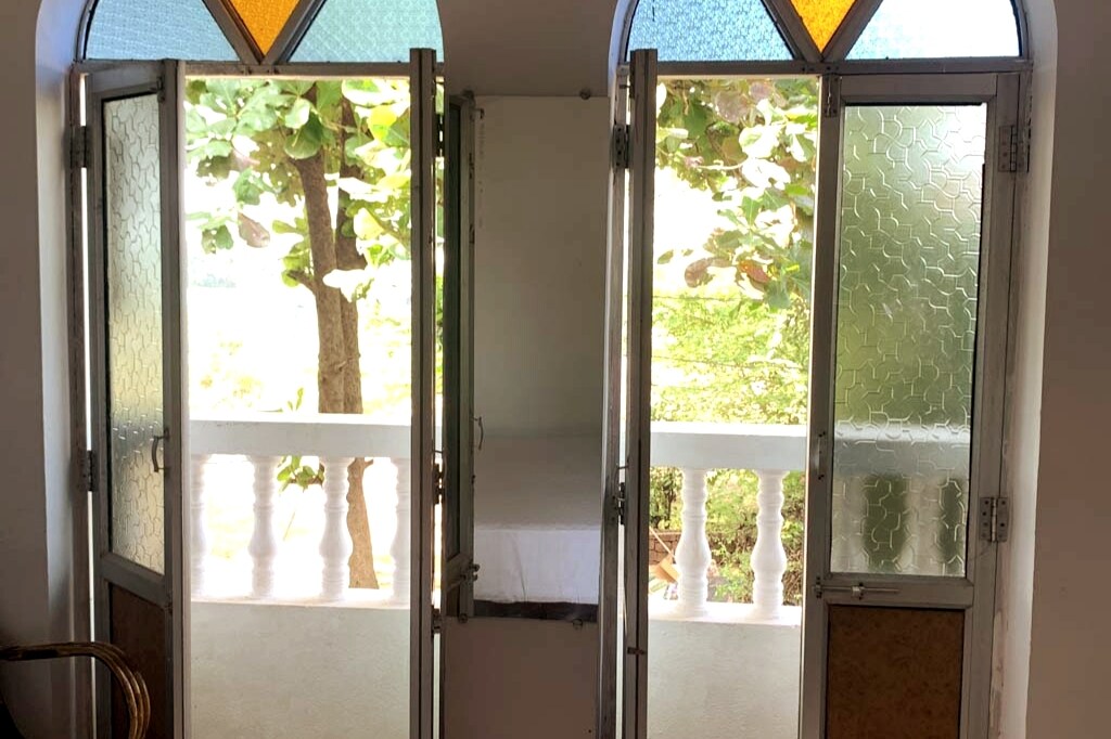 Monty's Vailkanni Seaview Air Con Room 1 Doors to Balcony and sea view.