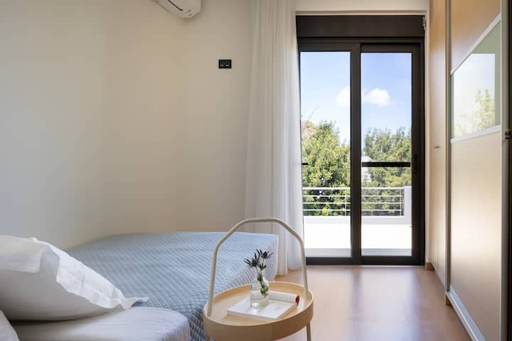 First floor bedroom featuring a single bed (1.10 X 2.00) and balcony access.