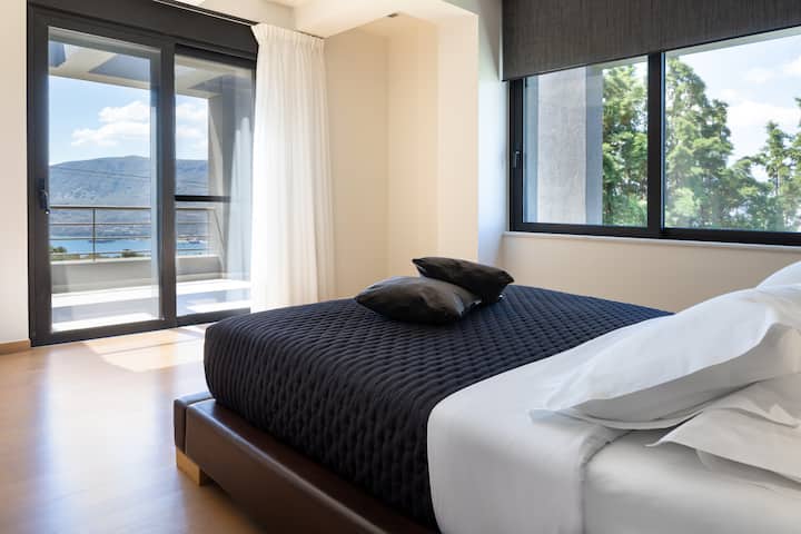First floor master bedroom with access to a private balcony.
