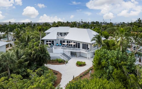 Successful Airbnb property: Golf cart~ Pool~Kayaks~Quiet beach~40’ dock in Captiva