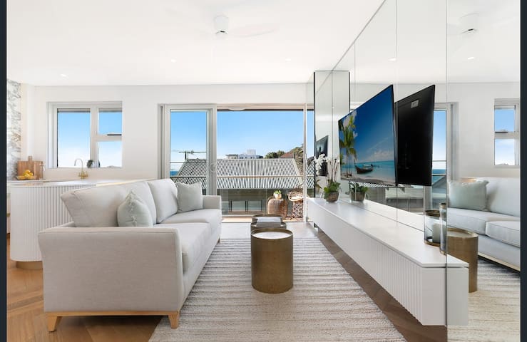 Luxury apartment footsteps from the beach!