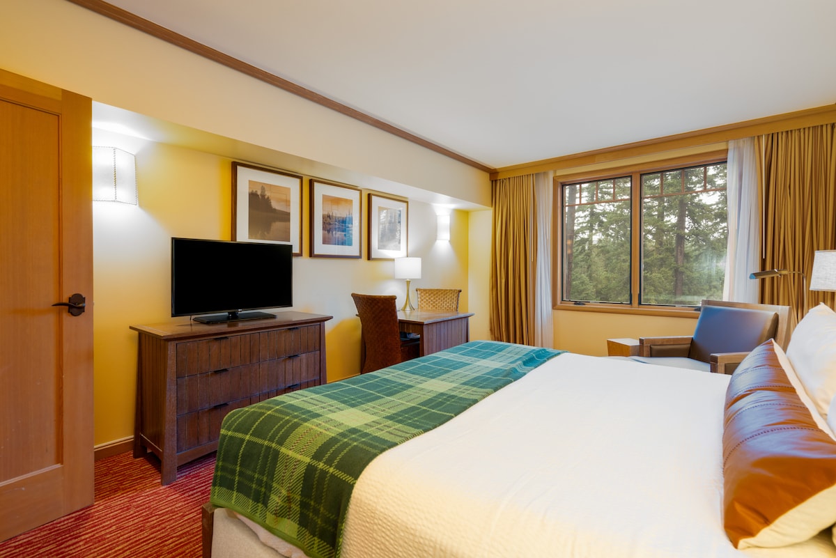 King Bedroom with TV, Desks and Forest View