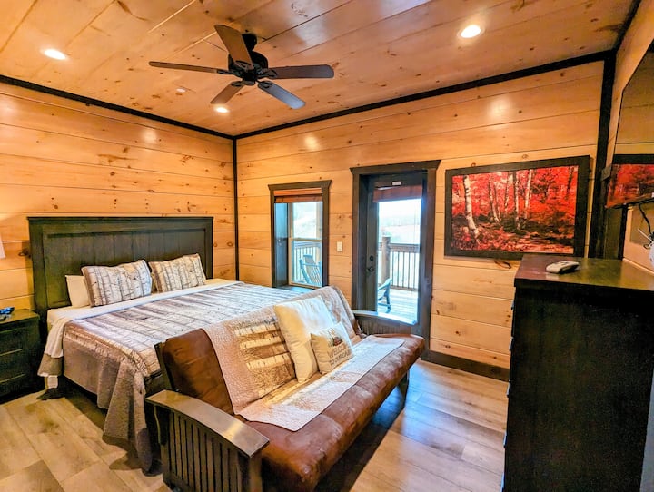 Bedroom 9 with sofa bed, patio access, mountain view and TV. 