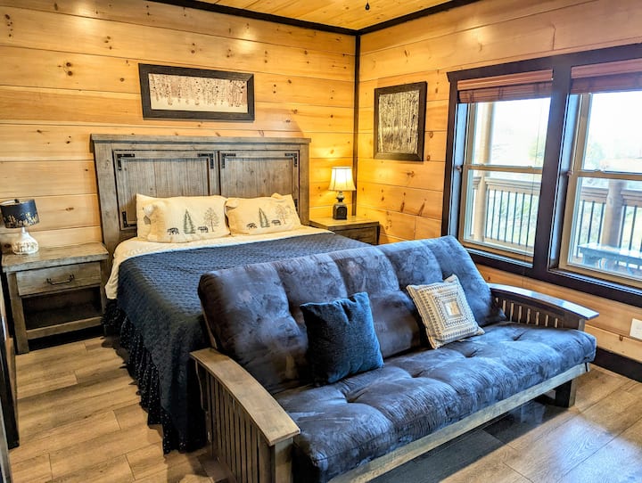 Bedroom 2 with patio access and mountain view. 