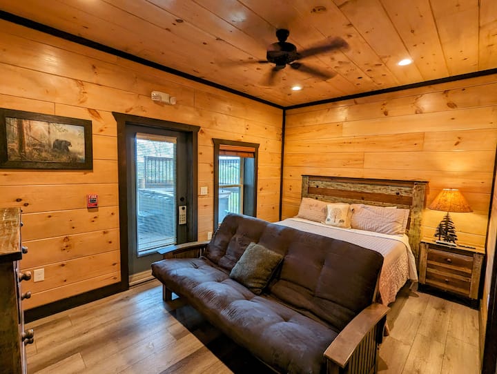 Bedroom 12 with sofa, patio access and mountain view. 