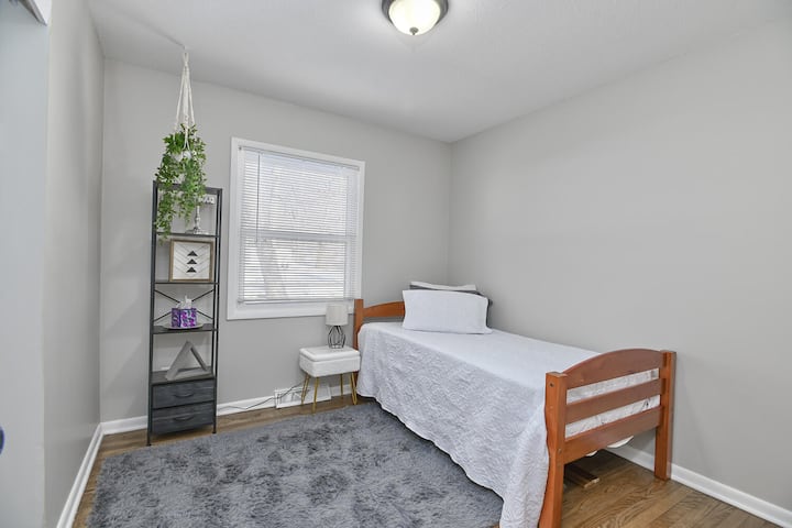 Bedroom on the main floor.  Room includes full sized closet.  Bed can remain single or be paired with the other bed to make a bunk bed. 