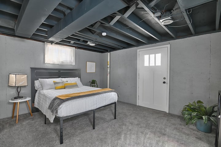 Bedroom on the lower level. Room includes full sized closet. Door goes to the backyard.