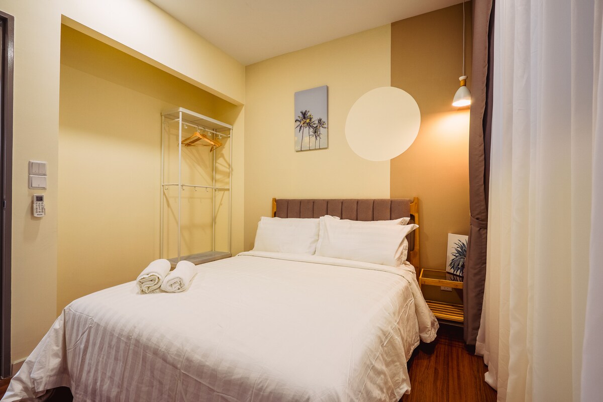 The third bedroom offers a cozy retreat with a view, enjoying the city lights through the window! 