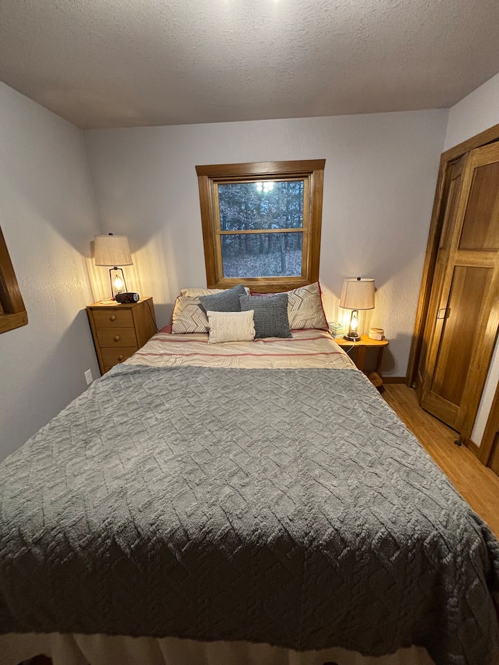 Bedroom on the main floor with queen size bed and two closets.