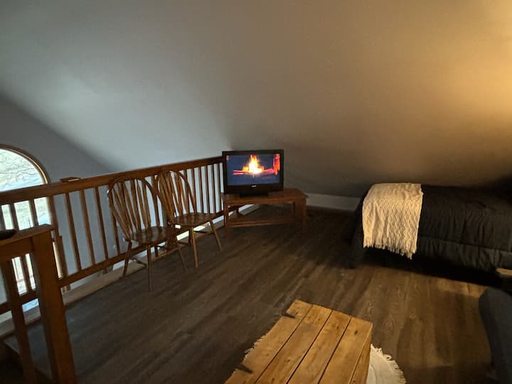 Television is on the second level including a futon and two twin beds.  Relax and enjoy your favorite movie with the Amazon Fire Stick.