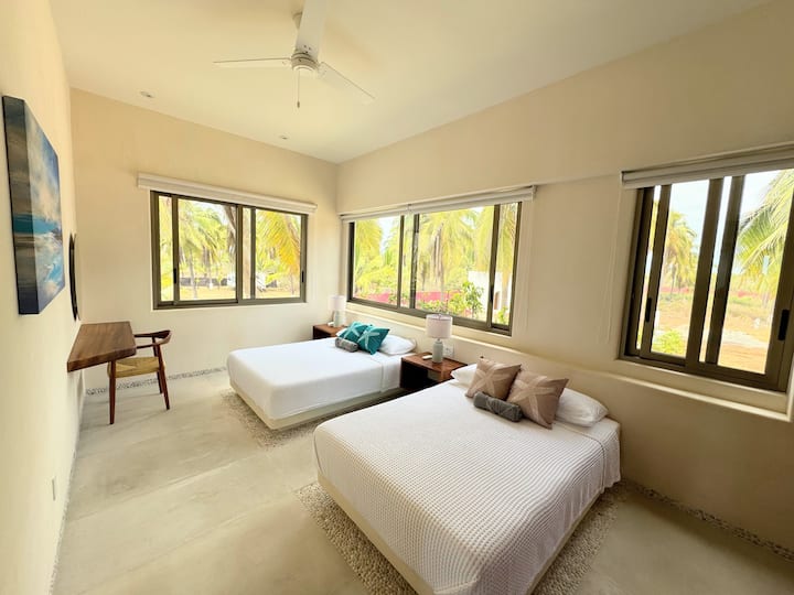 Upstairs bedroom with 2 double beds