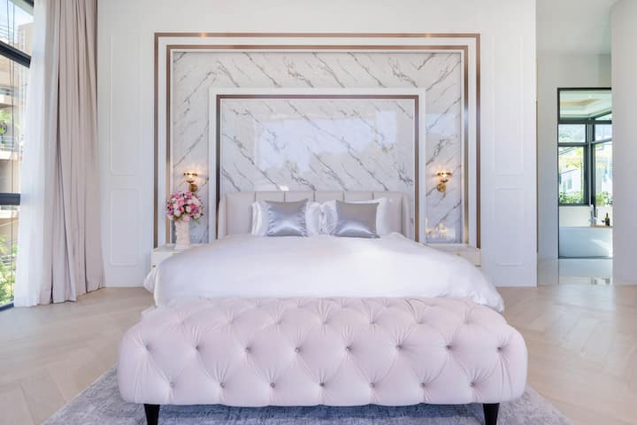 Master bedroom with marble wall