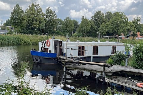 Quaint houseboat with large jetty