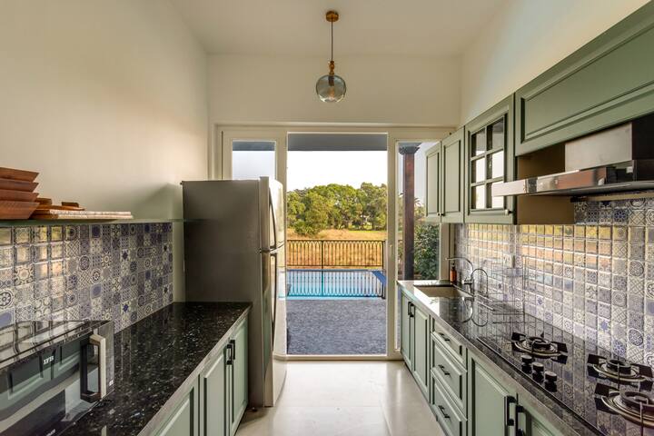 ✨This charming kitchen opens out to lush views and a sparkling pool-where every dish is made with a side of serenity✨