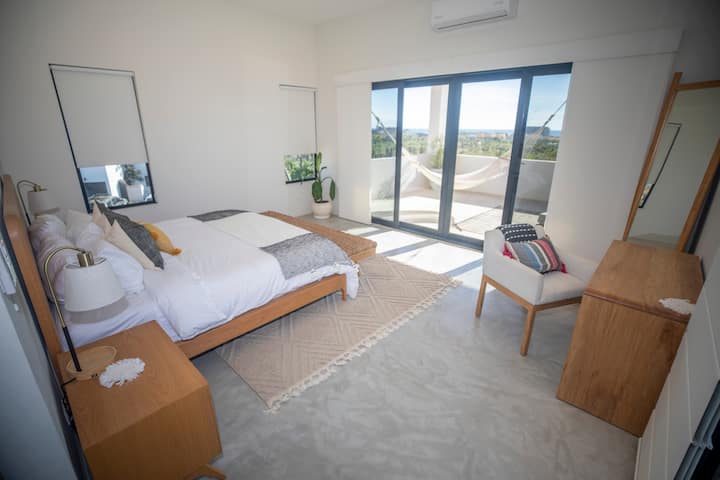 My favorite bedroom - 2 decks attached - one with hammock. Views to the ocean