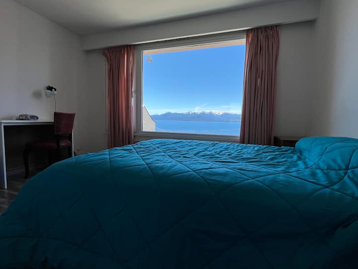 Bedroom 1, en-suite, with lake and mountain views, with workspace and walk-in closet