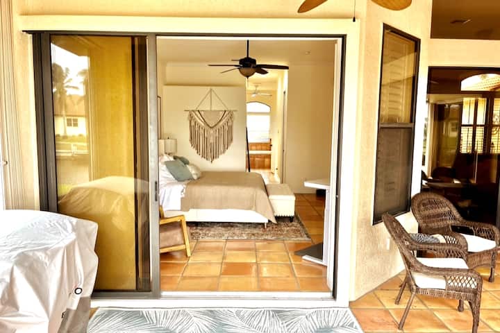 Master suite with large two door slider can open up for view of pool and canal