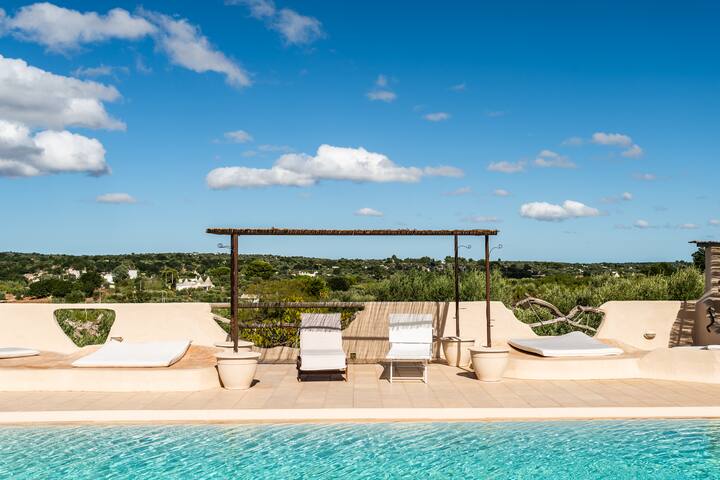 Trullo Granaio: piscina nella roccia e natura gallery image 2