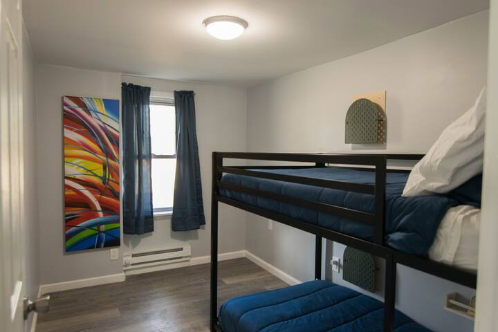 The second bedroom has bunk beds -- two twin mattresses.  Each bed has its own storage along the wall for books, tablets, etc..