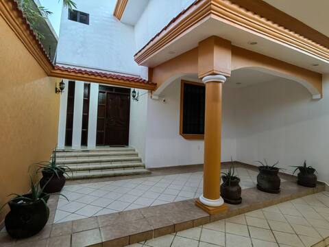 House 4 bedrooms with AC and gated carport 2 cars
