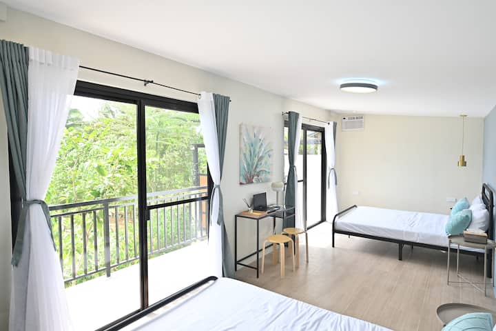 Bedroom1 with two Twin Beds and balcony with garden view