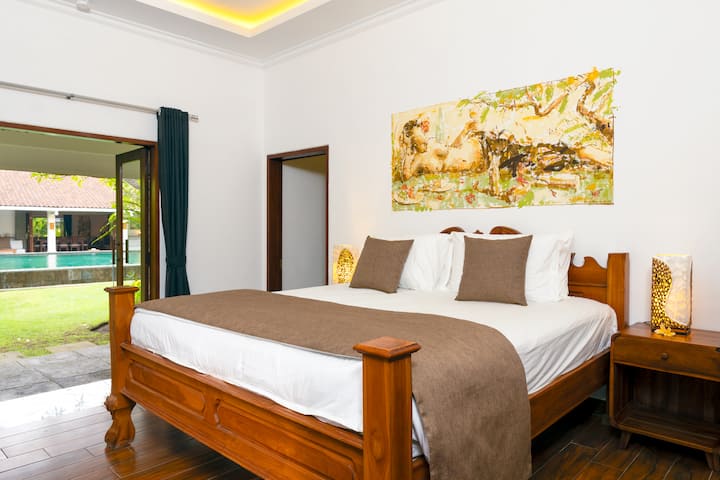 Bedroom-2 in the bungalow with a king size bed.