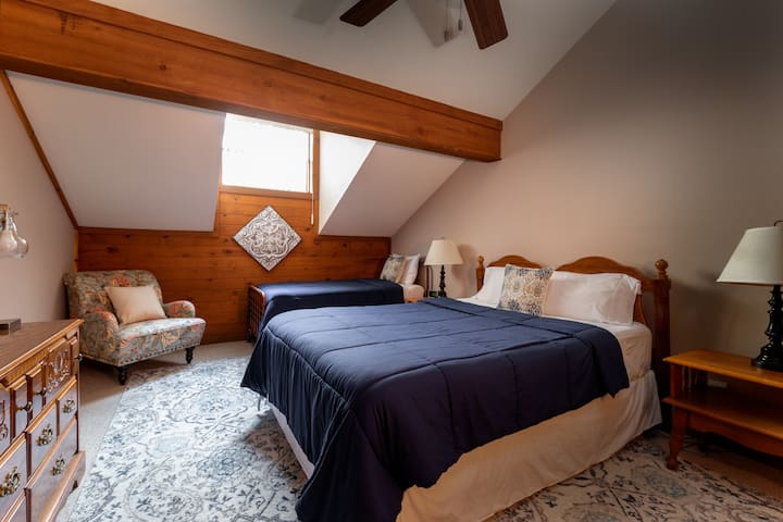 Two comfy queen beds, dresser, flat screen tv