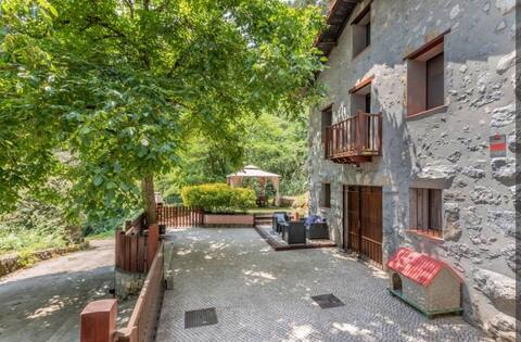 Cozy stone house among groves