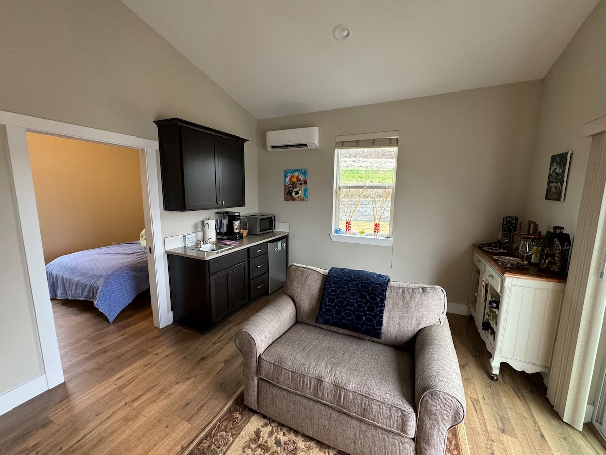 Silla de gran tamaño que se despliega en una cama doble con un colchón de rejilla 