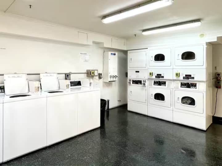 Shared laundry space with modern coin/card operated washing machines & dryers. (24hr access)