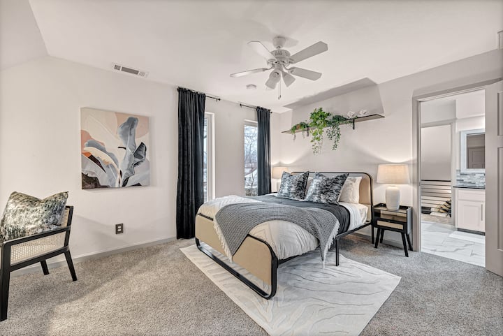 The first upstairs bedroom right off of the stairs has a walk in closet and is connected to a shared bathroom.