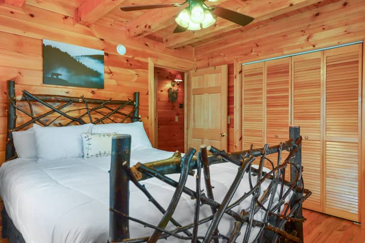 Main level Bedroom w/ Queen size bed and closet for storage and ceiling fan 