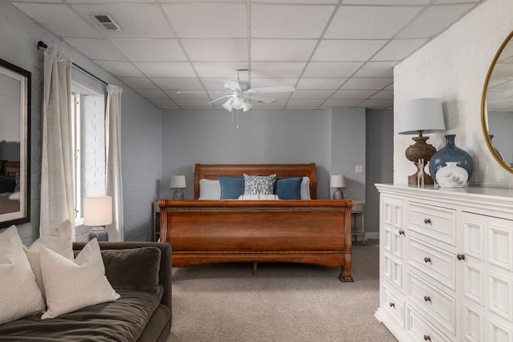 Primary suite offers a huge walk in closet, office space, vanity, king bed and a day bed for relaxing with a book.