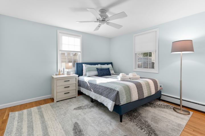 Main floor bedroom with one queen bed