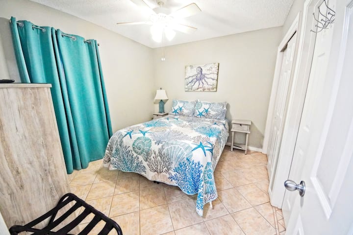 Master bedroom with a comfy queen bed 