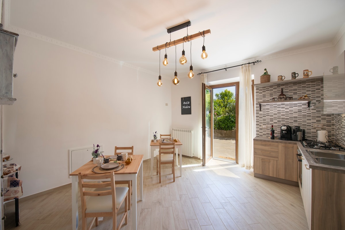 HedraRooms bedroom and kitchen -N - Apartments for Rent in Pianillo,  Campania, Italy - Airbnb