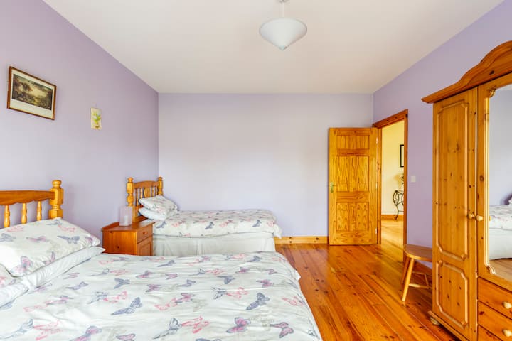 Bedroom 1, Front bedroom downstairs with double bed and single bed.