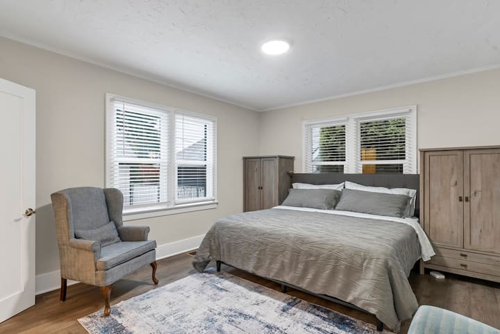 Master bedroom with King size bed and 2 large dressers.  