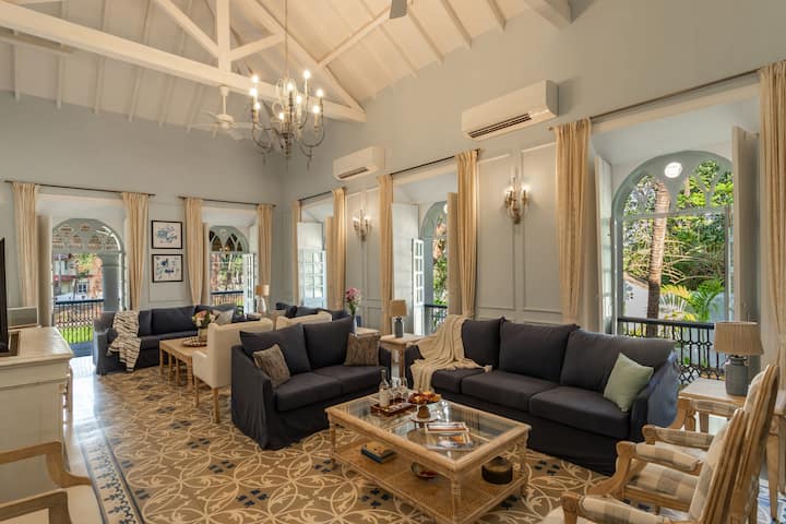 ✨A sunlit living room with arched balconies, high ceilings, and serene views-perfect for relaxed, timeless gatherings✨