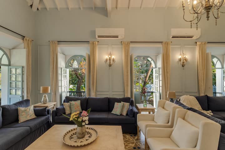 ✨This airy lounge, with soft sunlight spilling through classic arched windows, offers a peaceful setting for long, lazy afternoons✨