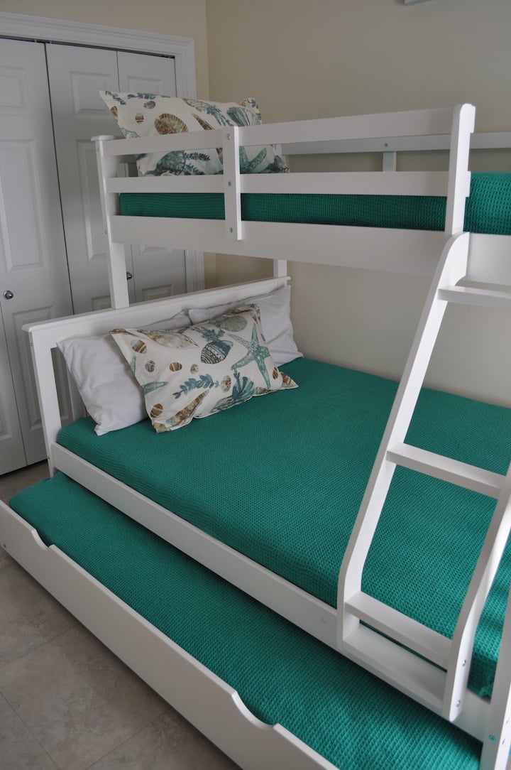 A bunk room perfect for the kids! Twin over full with a twin trundle.