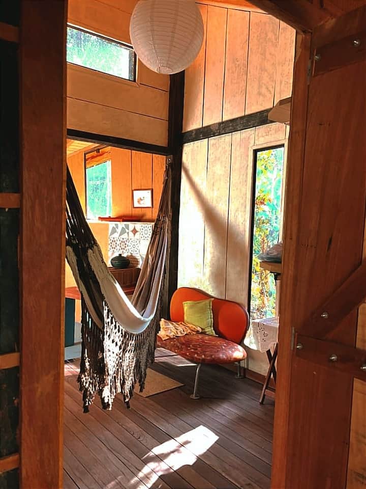 main entrance, living room, hammock and wood fogao.